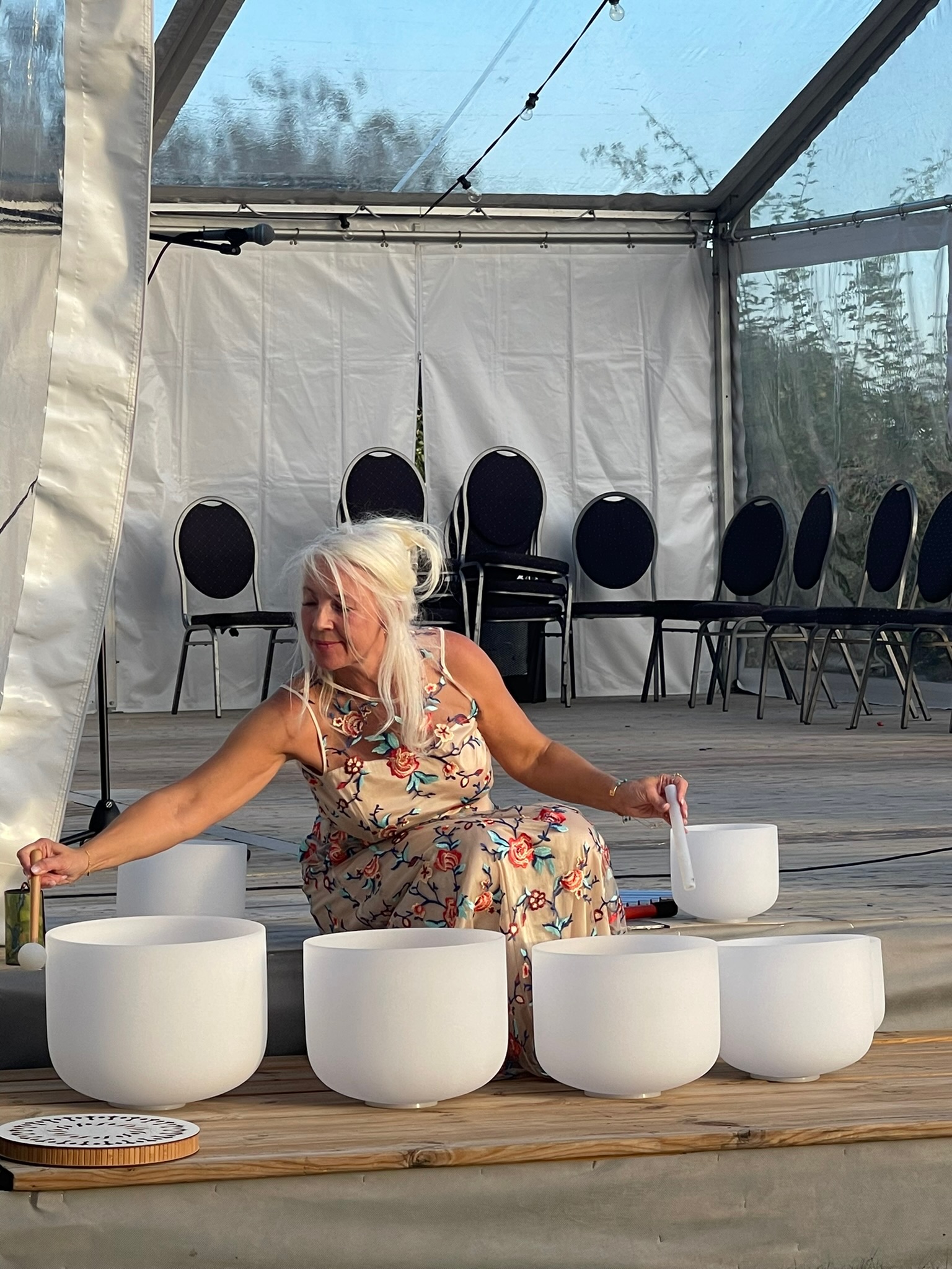 Aurelina playing crystal singing bowls during the outdoor sound meditation